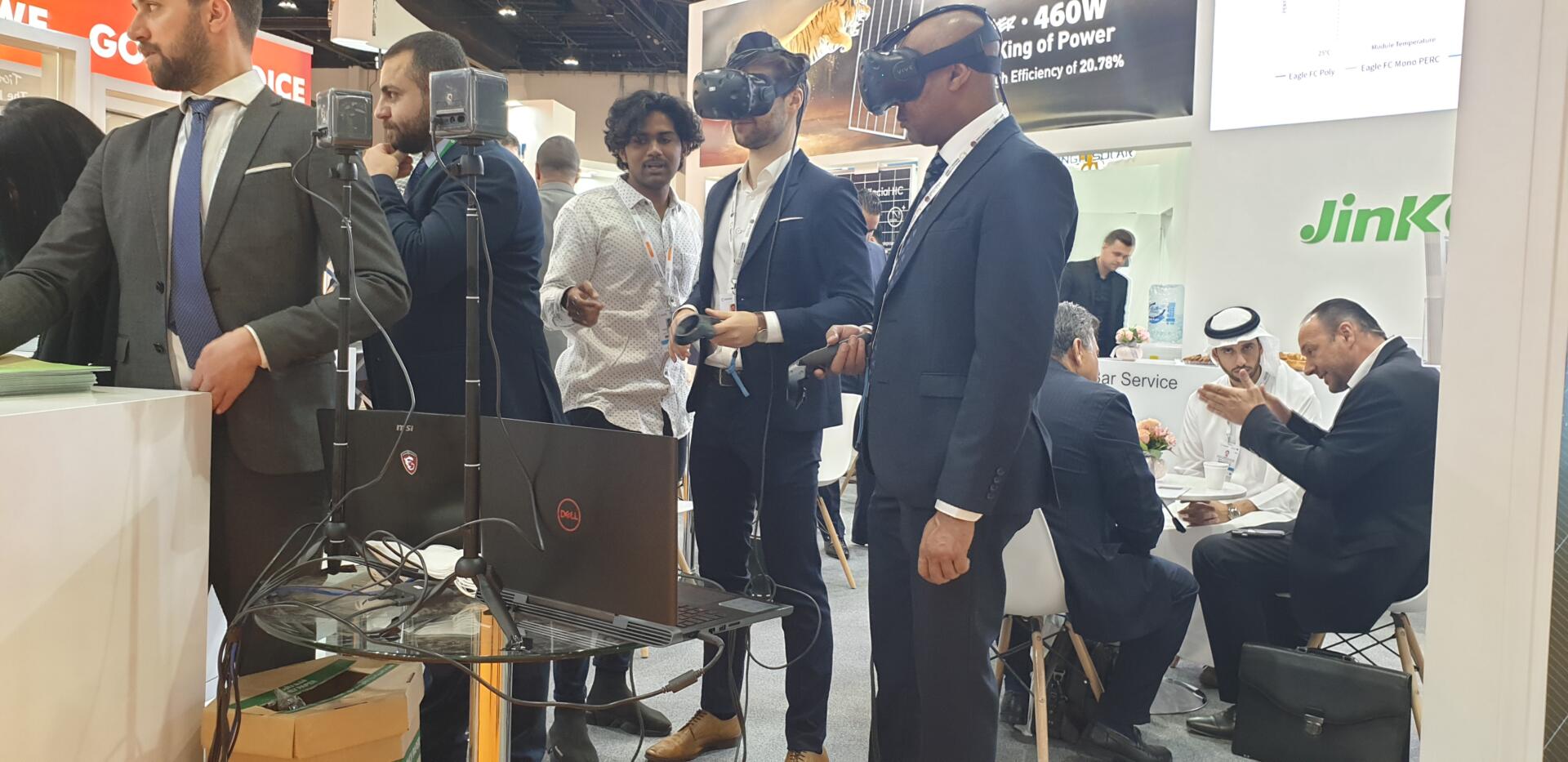 Visitors experiencing Jinko Solar's virtual reality tour of a solar power plant.