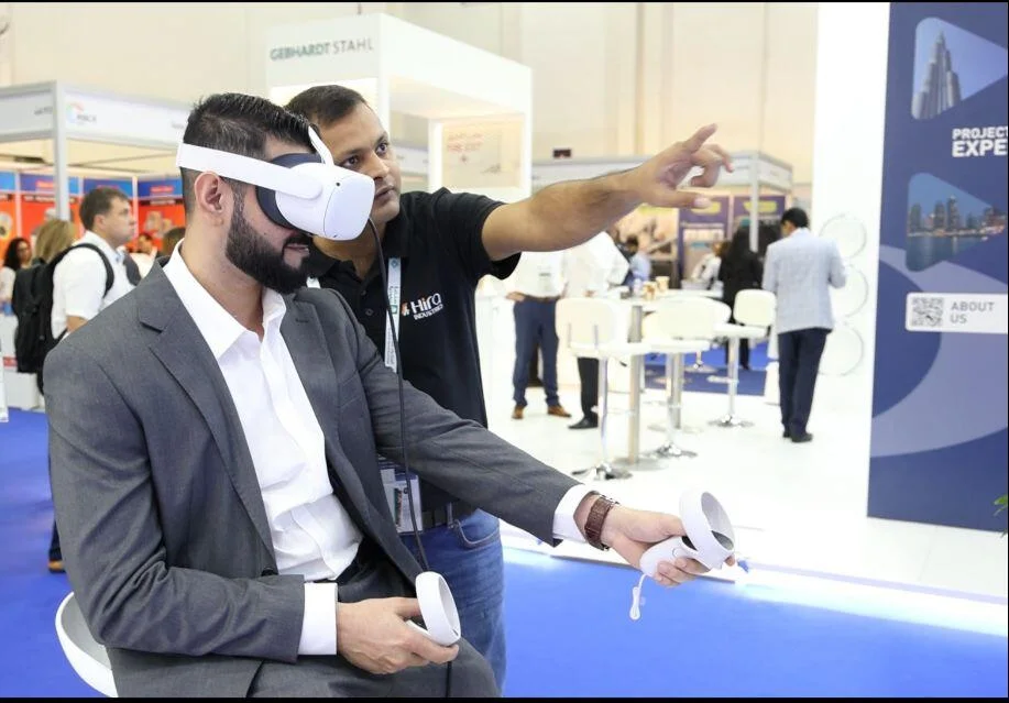Person interacting with Hira Industries' VR product showcase in a virtual construction site.