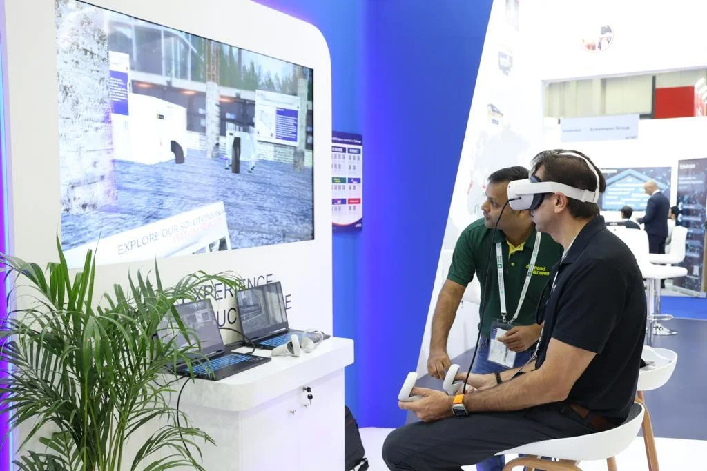 Person interacting with Hira Industries' VR product showcase in a virtual construction site.