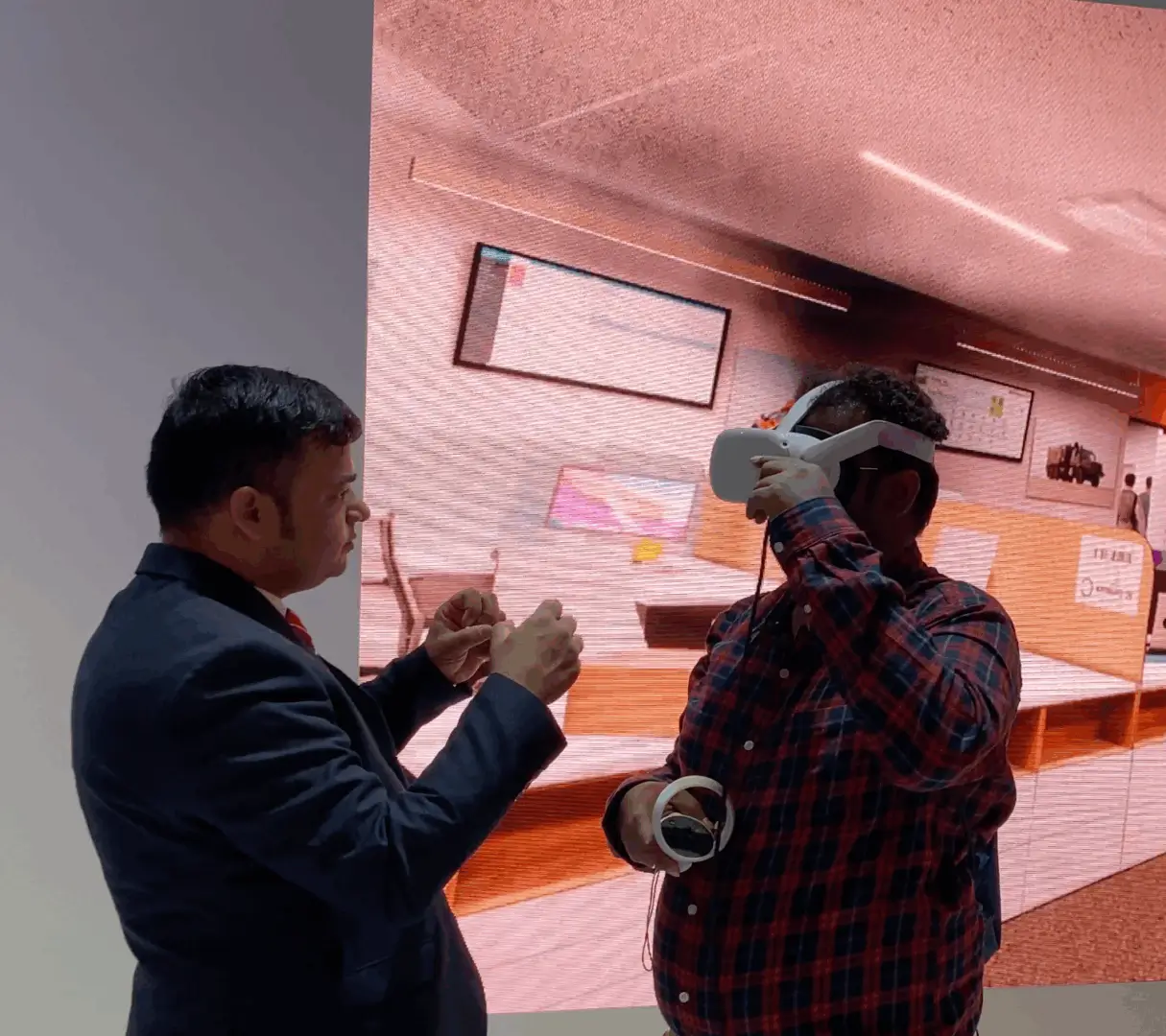 User experiencing NAFFCO's VR smoke management simulation in an office environment.