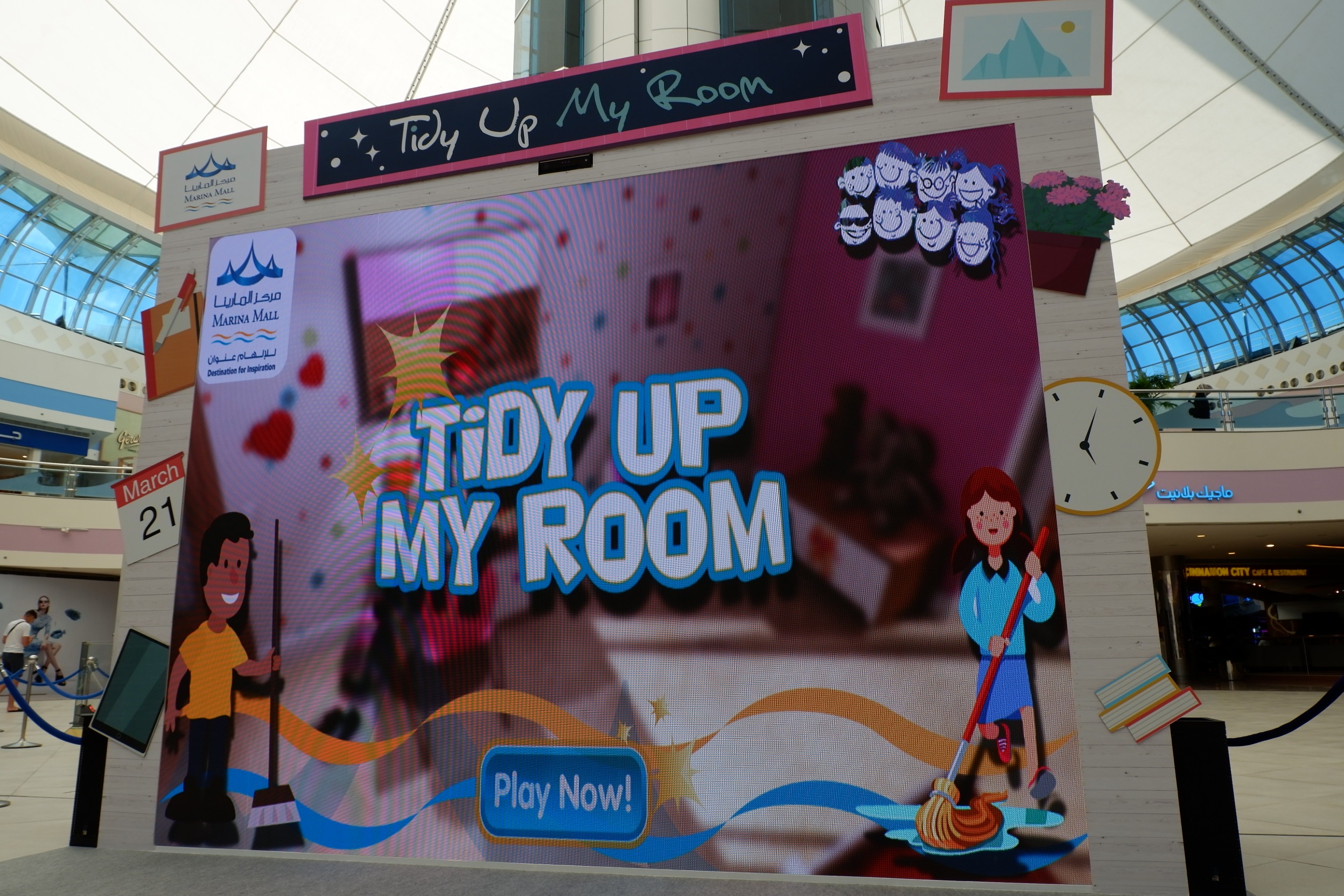 Children playing the Tidy Up My Room gesture game at Marina Mall Abu Dhabi.