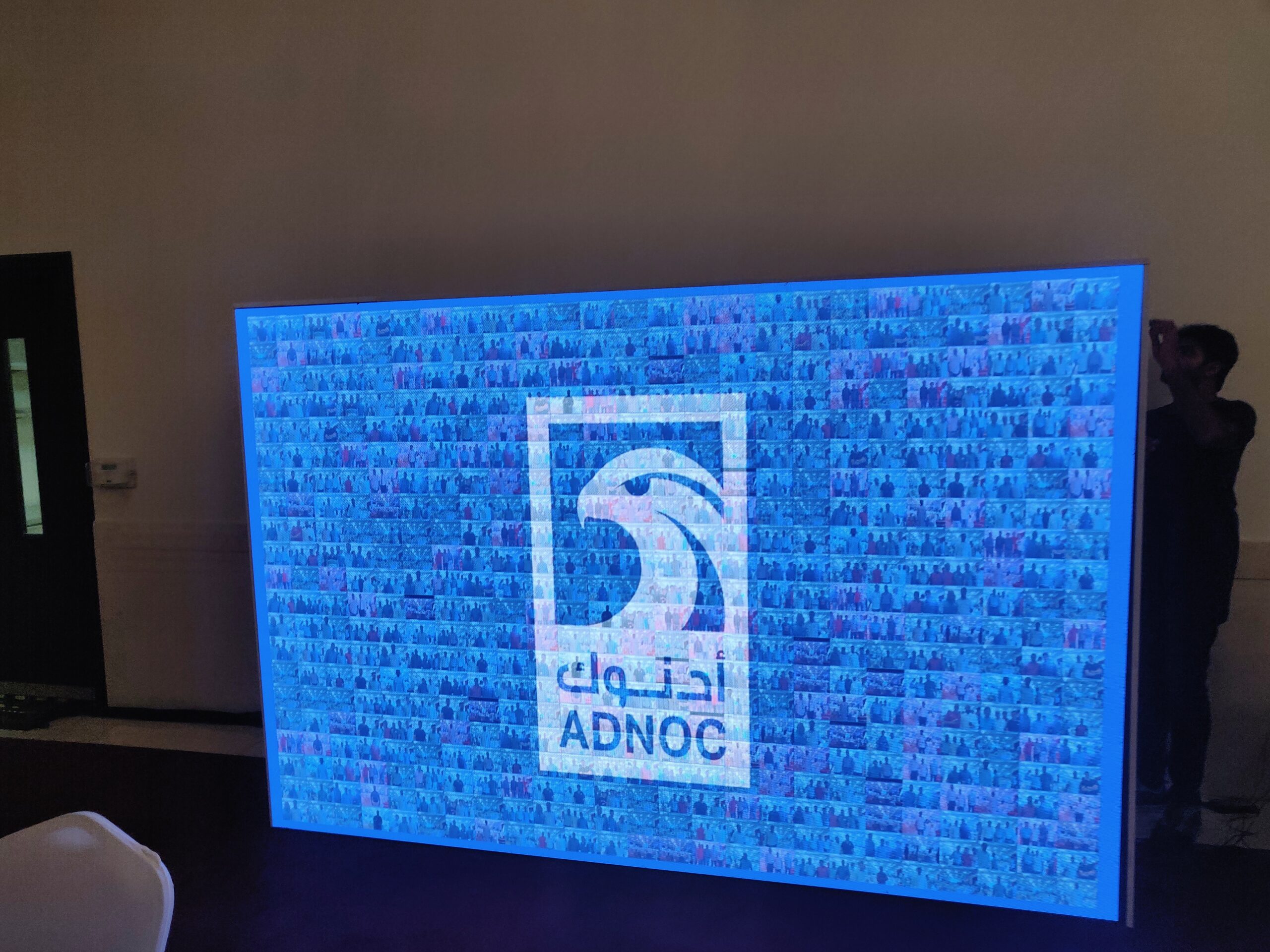 ADNOC Town Hall interactive photo mosaic kiosk and SMS Q&A system by PearlQuest.