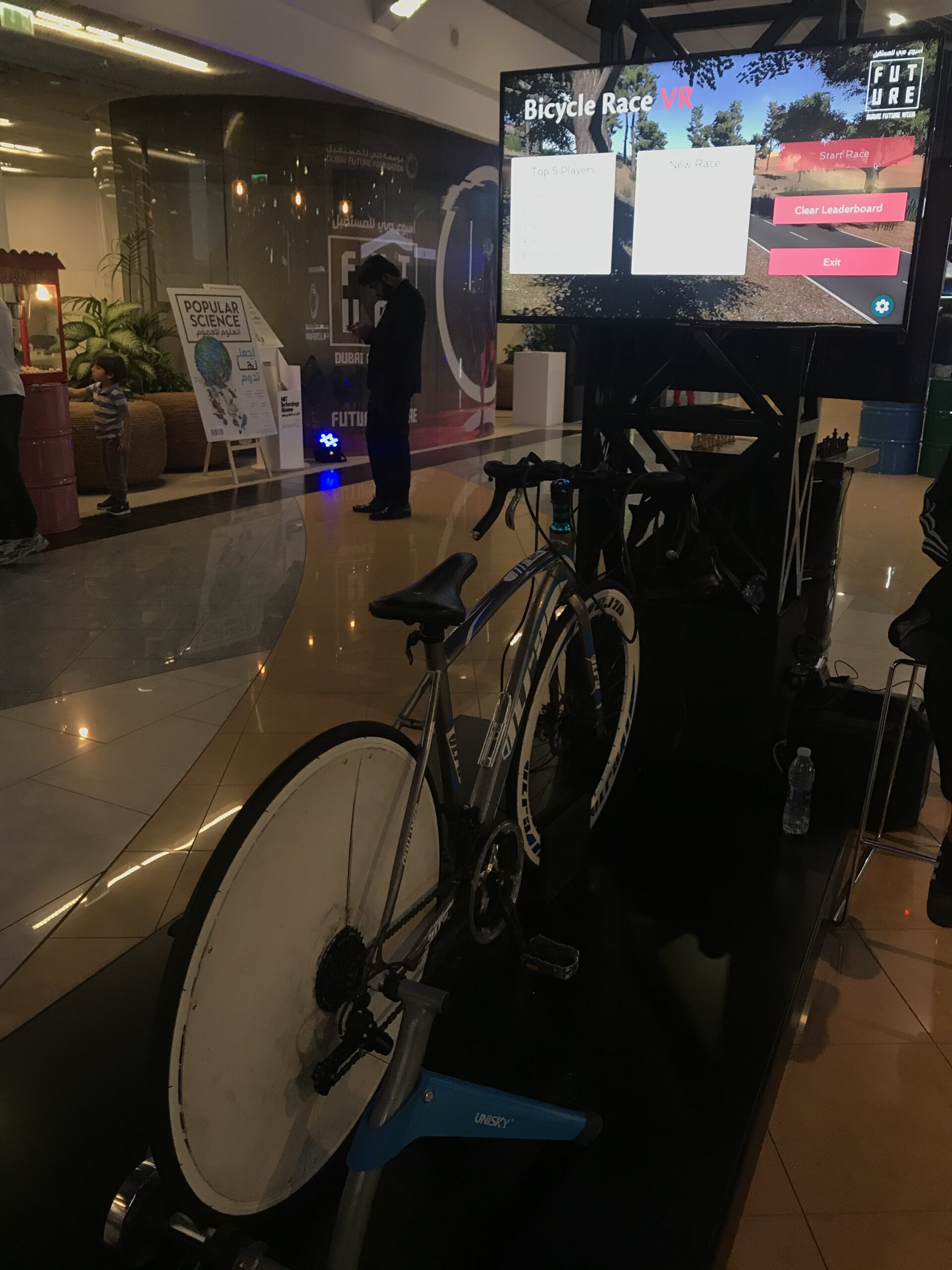 VR cycling station with immersive desert visuals for Dubai Future Week.