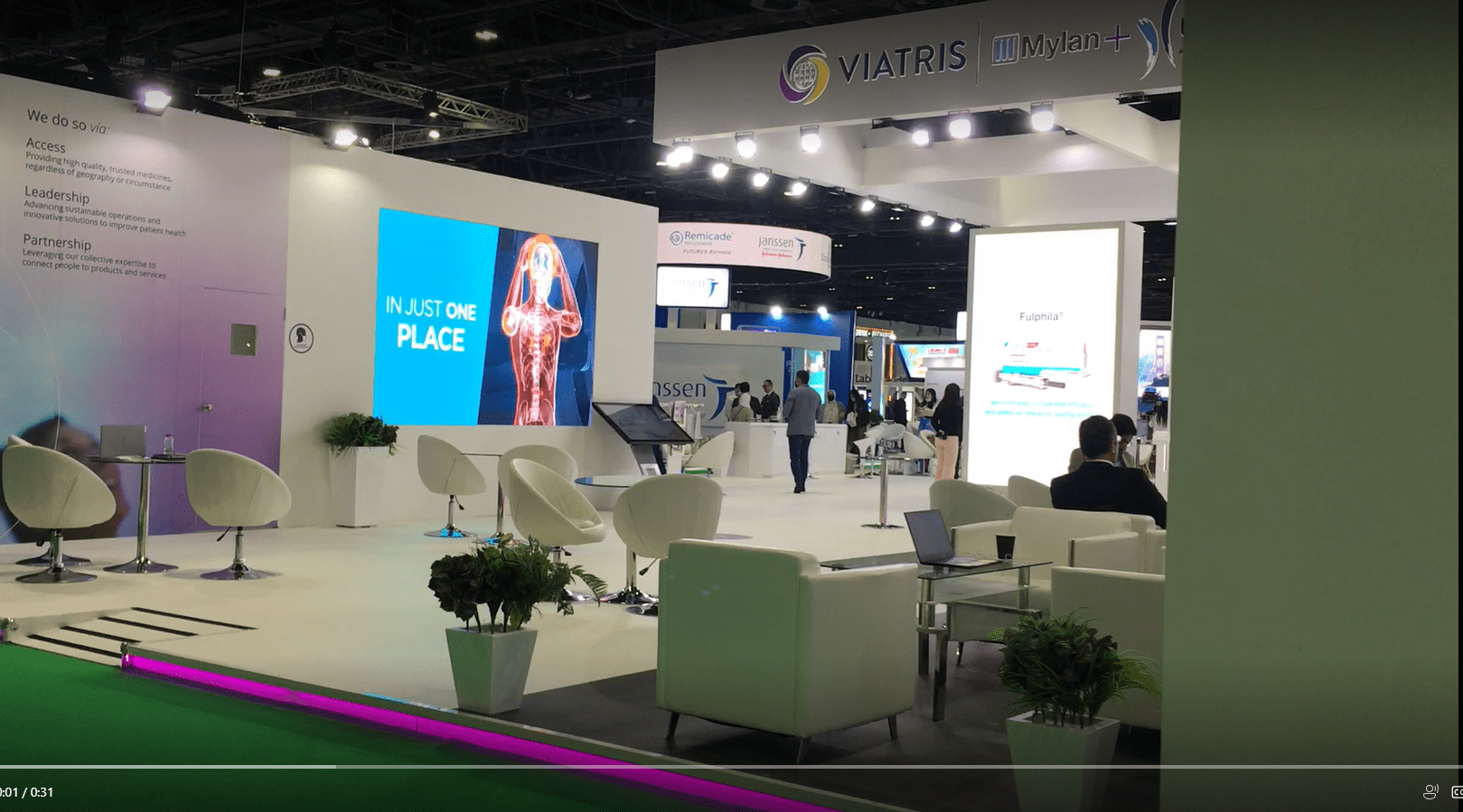 Interactive touchscreen controlling large LED wall at DUPHAT 2022 pharma exhibition.