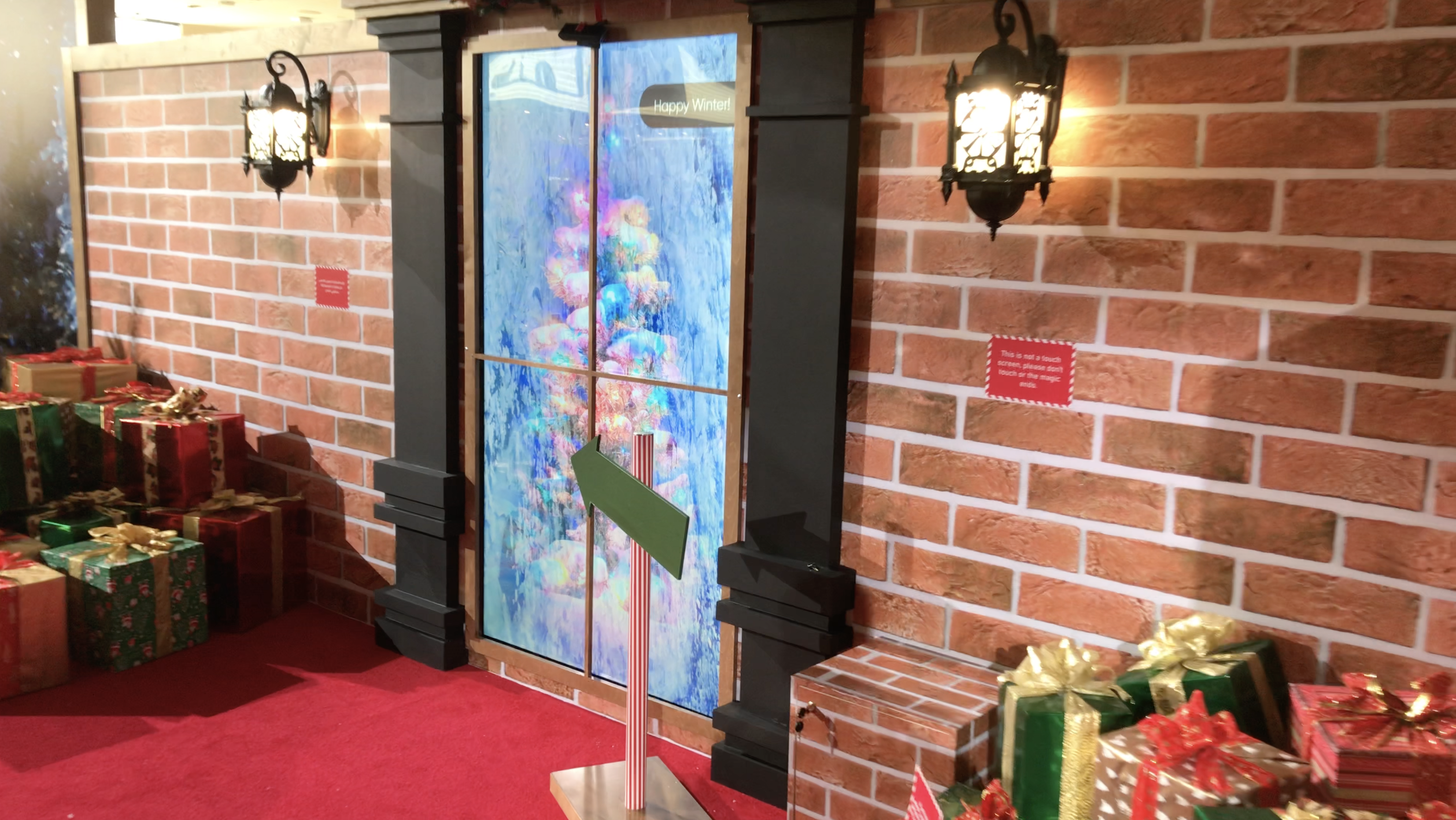 Interactive Christmas window display at Galleria Mall Abu Dhabi featuring gesture technology.