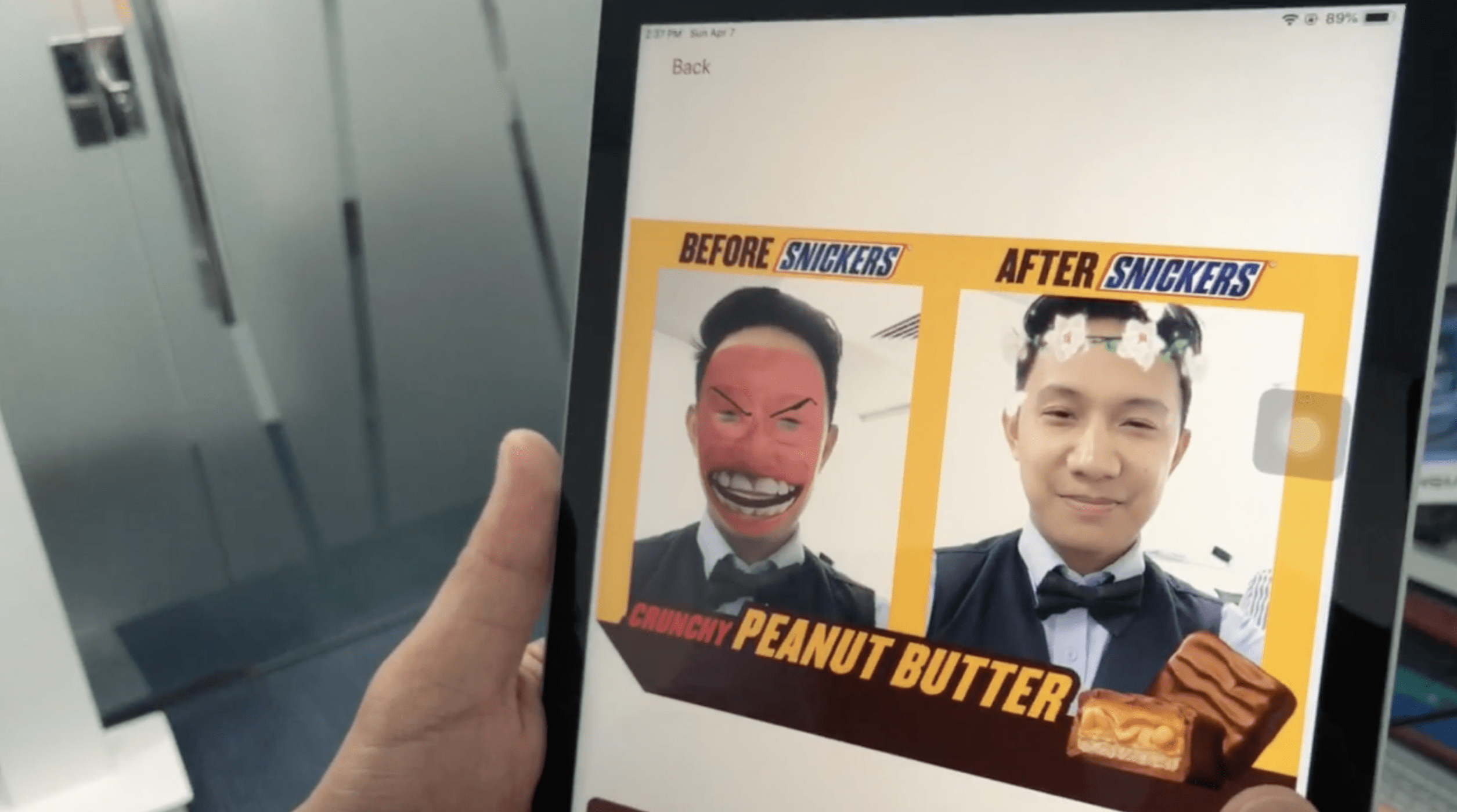 User engaging with Snickers custom AR face filters on a tablet.