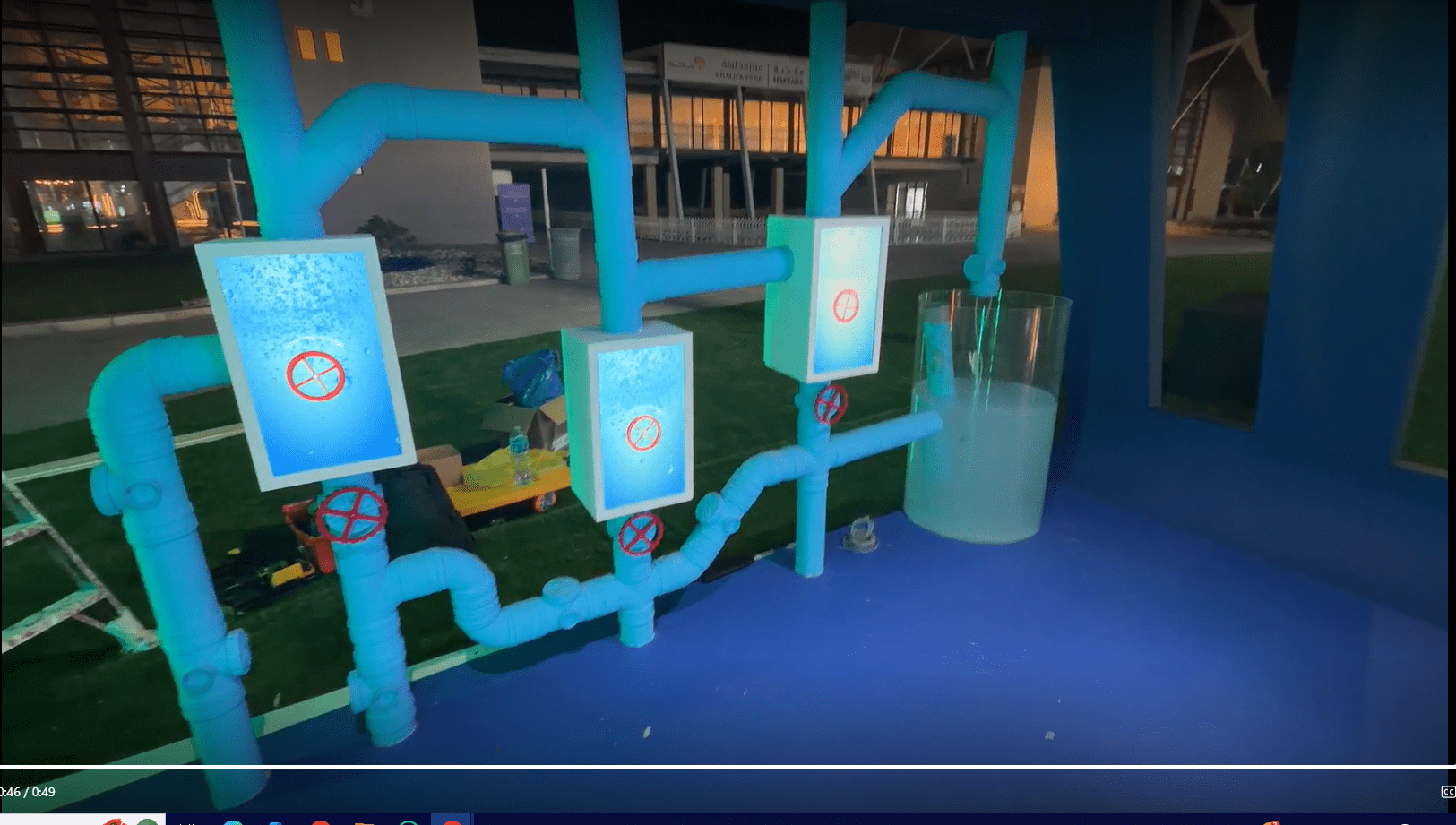 User turning a physical valve to trigger digital water flow in the TAQA installation