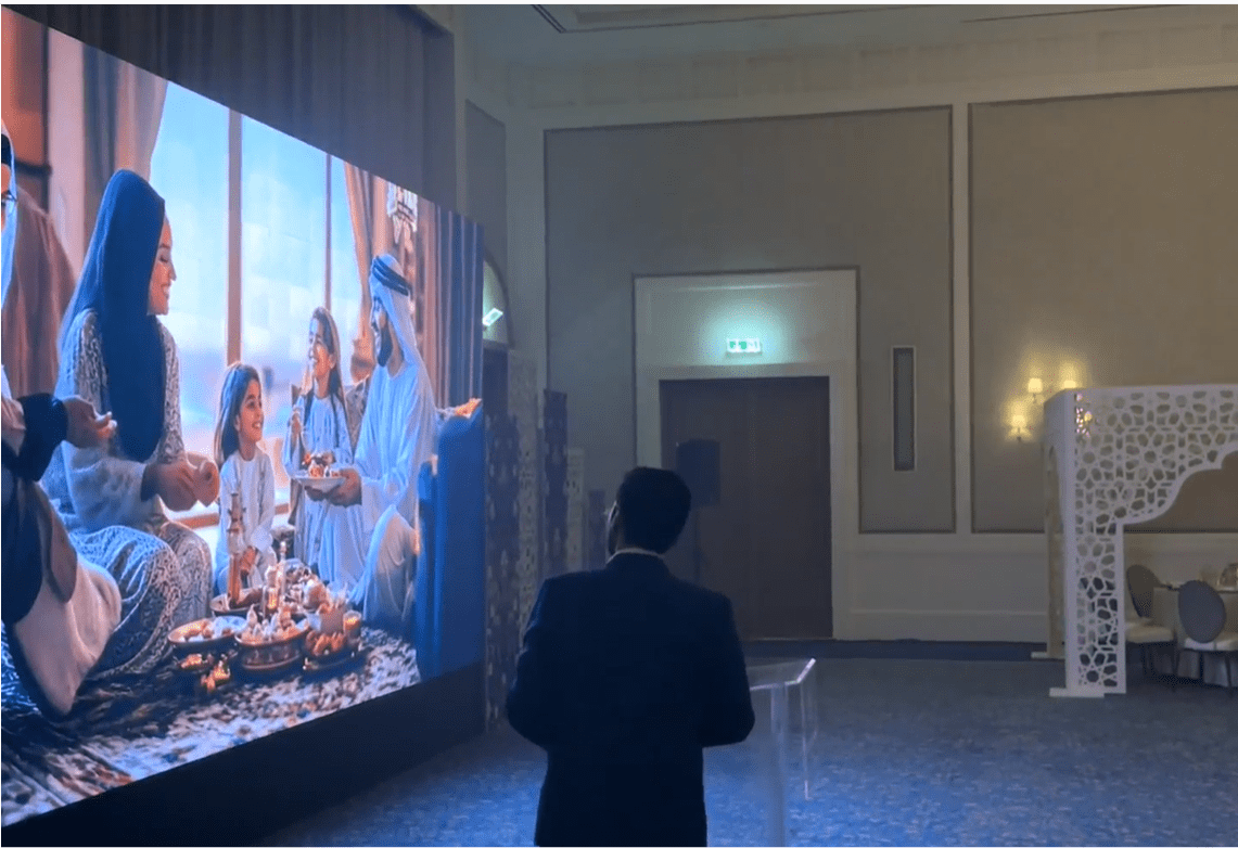National Bond 2025 corporate event featuring an immersive AI video production on a large display.