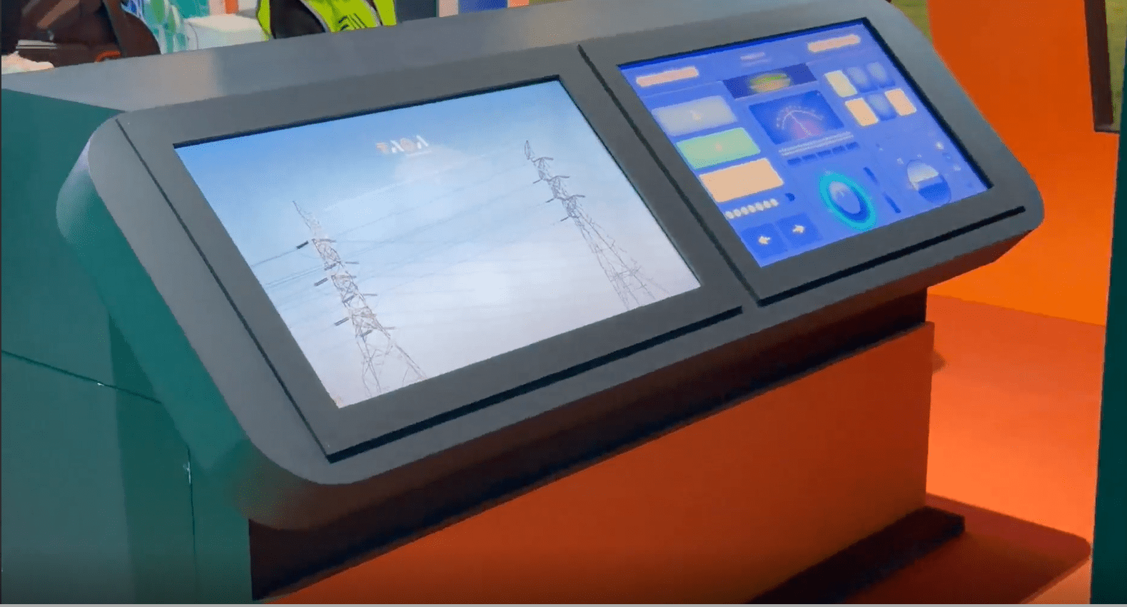 Interactive dual-screen gamified kiosk for TAQA Transmission power grid exhibition